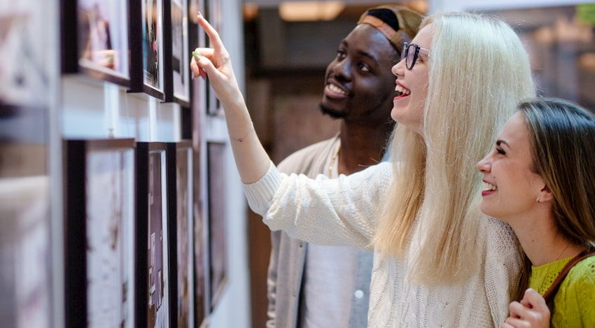 a group of friends admire art in a Los Angeles, California