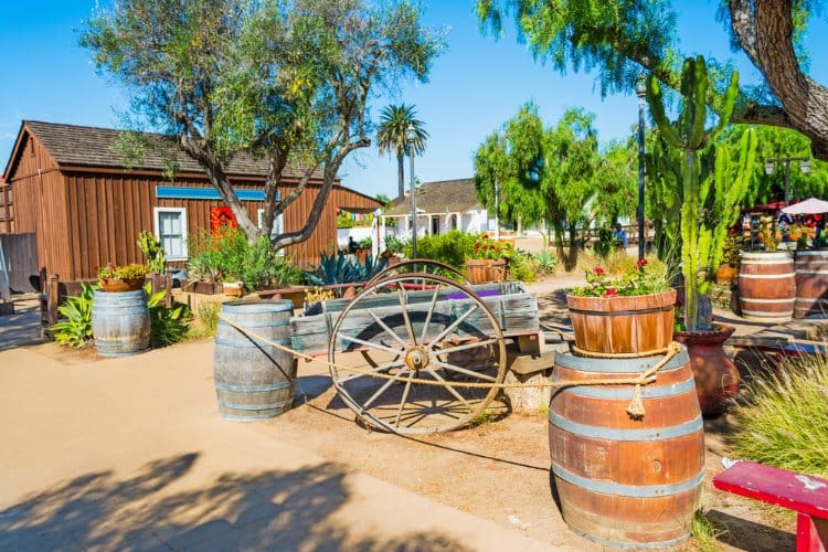 Image of old barn with wagon in front of it in Old Town San Diego