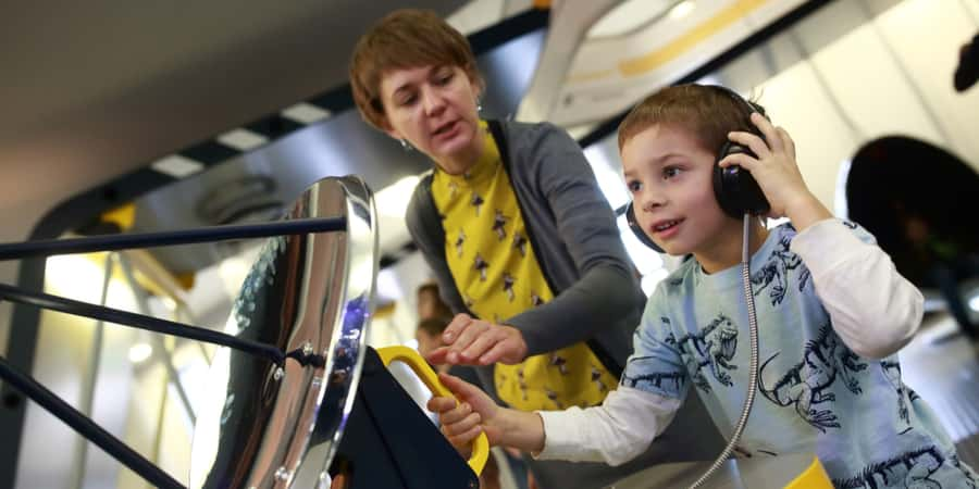 A student and teacher at a space exhibit in the California Science Center