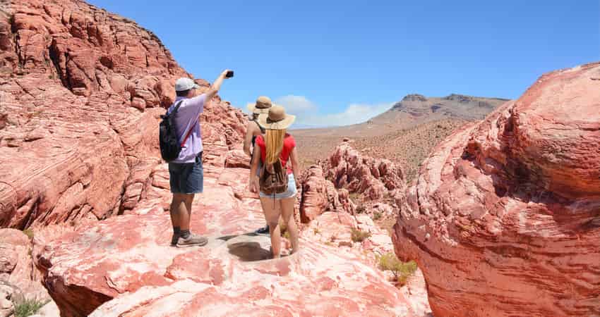 A group of people hiking at Red Rock Canyon Conservation Area