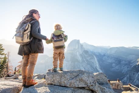 A woman and young boy hiking at Yosemite National Park