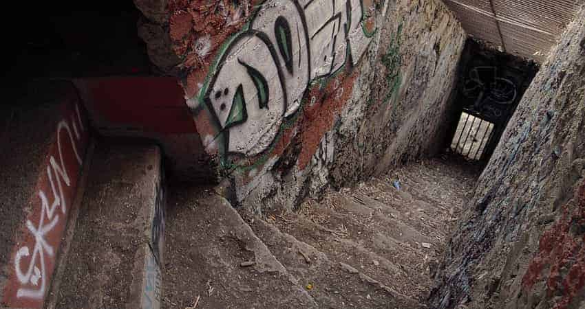 A stairwell to an old animal enclosure covered with graffiti at the Old Griffith Park Zoo