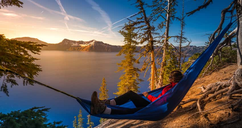 A visitor in a hammock overlooking Crater Lake