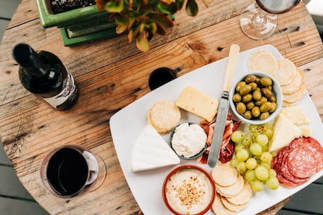 a table of food with charcuterie