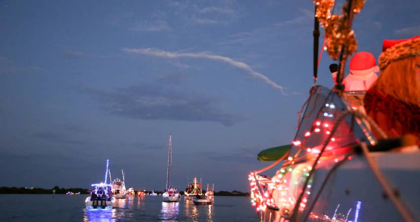 A holiday boat parade with decorations