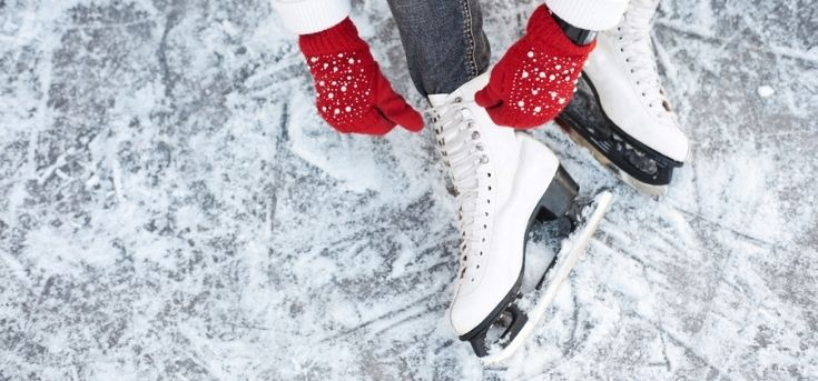 Person tying on ice skates