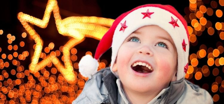 child marveling at christmas lights