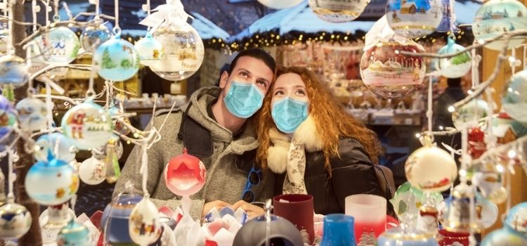 people admiring christmas shopping display