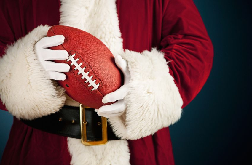 santa claus holding a football