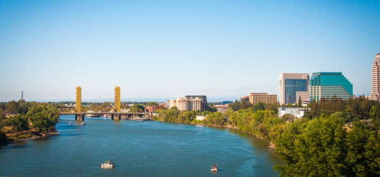 View of Sacramento skyline and Tower Bridge across the river during the day